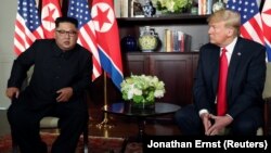 Ким Чен Ын и Дональд Трамп. Сингапур 12 июня 2018 года