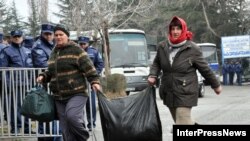 Internally displaced persons from the breakaway regions of Abkhazia and South Ossetia leave their shelter in Tbilisi on January 20.