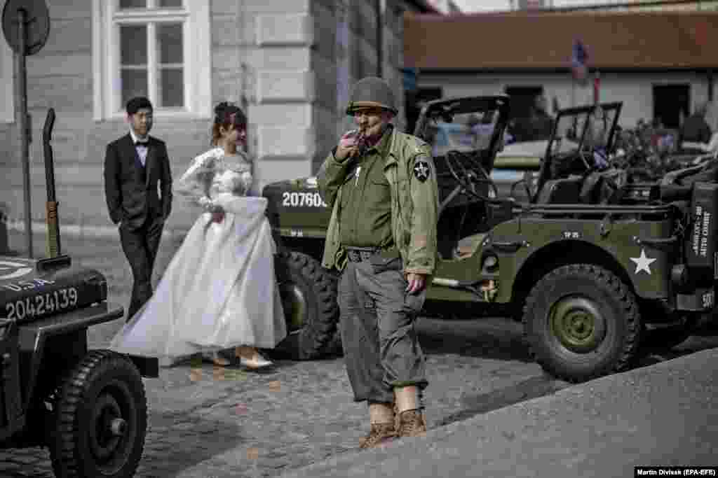 A history enthusiast dressed in a U.S. Army uniform from World War II smokes a cigar during the &quot;Convoy of Liberty&quot; in Prague. The convoy commemorates the liberation of the western part of what was then Czechoslovakia from Nazi oppression by the U.S. Army at the end of the World War II. (epa-EFE/Martin Divisek)