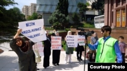Relatives of arrested Islamic Party activists protested in front of the president's offices in Baku in June. The crackdown on the party has since intensified.