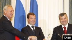 Russian President Dmitry Medvedev (center), with South Ossetian and Abkhaz leaders Sergei Bagapsh (left) and Eduard Kokoity, has moved quickly to "normalize" diplomatic ties with both regions.