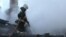 Tajikistan/Russia -- Russian fireman battle with a fire at house near Moscow,while five tajik migrant death, 5 January 2014