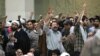 در روز ۲۲ بهمن سال جاری عده‌ای با پرتاب مُهر نماز و کفش و نعلین مانع سخنرانی رئیس مجلس ایران شدند.