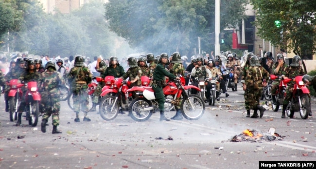 Iranian special units sit on motorcycles as they face protesters during a demonstration in Tehran on June 20, 2009.