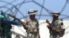 Iraq -- Iraqi police commandos stand guard at a checkpoint during a city-wide ban on traffic, in central Baghdad, 30Mar2008