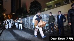 Turkish forensic police officers leave after searching for evidence at the Saudi Consulate in Istanbul on October 18.