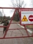 Belarus -- An employee closes the gate at the entrance to the exclusion zone around the Chornobyl nuclear reactor, southeast of Minsk, April 21, 2015