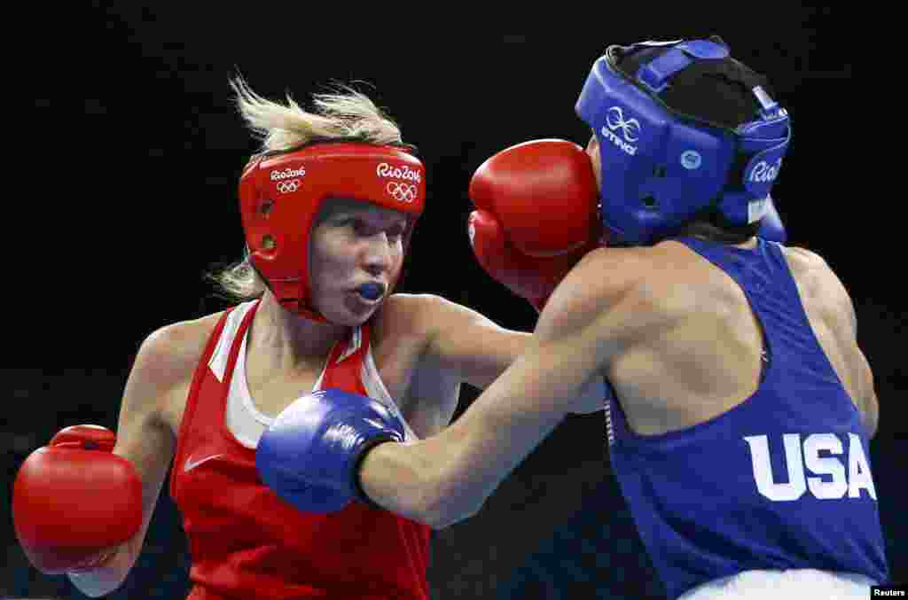 Anastasia Belyakova of Russia fights Mikaela Mayer of the United States in the women's 60-kilogram boxing quarterfinals.