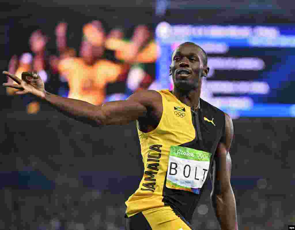 Usain Bolt of Jamaica celebrates winning the men's 4 x 100-meter relay final.