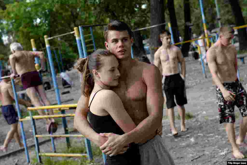 A young couple between workouts. As well as old and young, the legendary gym reportedly attracts rich and poor.&nbsp;