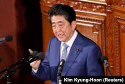 Синдзо Абэ выступает на первой сессии парламента Японии в 2018 году. 22 января