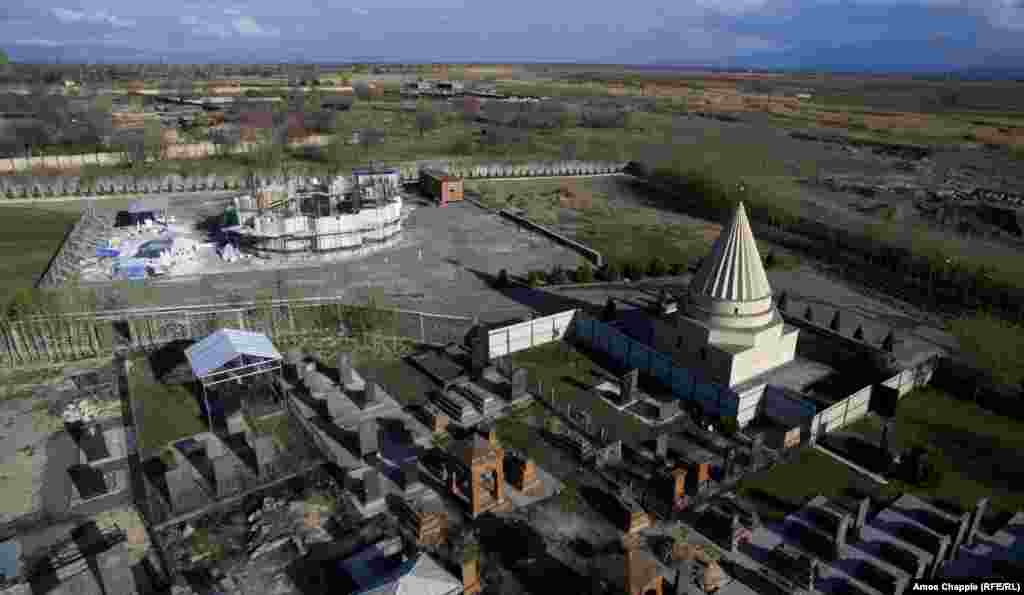 Aknalich is home to a small temple (right), which was completed in 2012, but a few meters away, the world&#39;s largest Yazidi temple is taking shape.&nbsp;The new edifice, carved from Iranian marble, is scheduled for completion in late 2018.