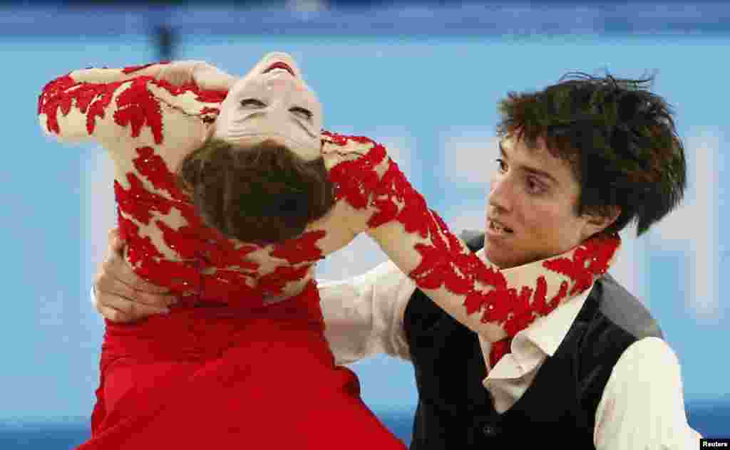 Canada&#39;s Alexandra Paul and Mitchell Islam compete during the figure-skating ice dance free program. (Reuters/Lucy Nicholson)