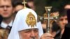 Russian Orthodox Patriarch Kirill blesses believers during a service in Kyiv on July 27.