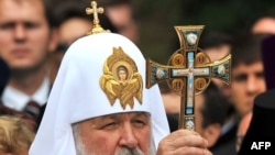 Russian Orthodox Patriarch Kirill blesses believers during a service in Kyiv on July 27.