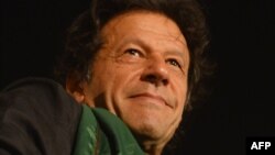 Pakistani opposition politician Imran Khan attends a protest in front of Parliament in Islamabad on August 20, 2014. 