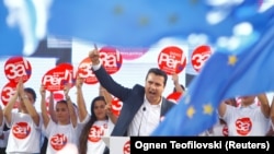 Macedonian Prime Minister Zoran Zaev addresses a march in support of a referendum on changing the country's name and its NATO and EU membership bids in Skopje oon September 16.
