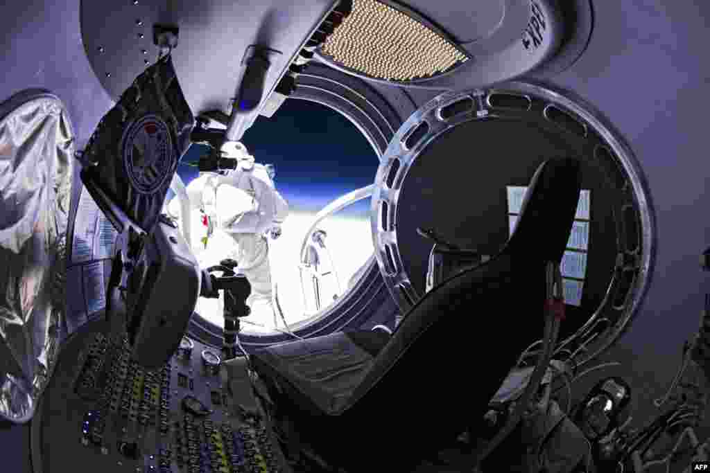Baumgartner is shown standing on the lip of the capsule just moments before his jump.