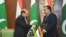 Tajik president Emomali Rahmon (R) with Pakistani Prime Minister Nawaz Sharif.