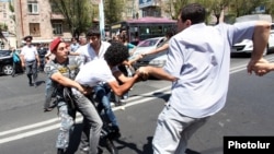 Armenia - Riot police clash with activists blocking a major Yerevan street in protest against the construction of a nearby building, 22Aug2013.