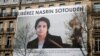 A banner with a giant portrait of jailed Iranian lawyer Nasrin Sotoudeh is seen on the headquarters of the French National Bar Council, demanding her release, in Paris, March 28, 2019