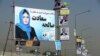 Campaign posters for Afghanistan's upcoming parliamentary elections are displayed on a Kabul street on September 28. 
