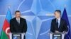 BELGIUM -- Azerbaijani President Ilham Aliyev (L) and NATO Secretary-General Jens Stoltenberg give a press conference at the end of a meeting at NATO headquarters in Brussels, November 23, 2017