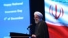 Iranian president Hassan Rohani speaks at the National Insurance and Development Conference in Tehran, December 4, 2019