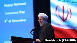 Iranian president Hassan Rohani speaks at the National Insurance and Development Conference in Tehran, December 4, 2019