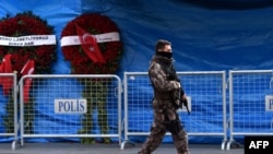 A Turkish special force police officer patrols in front of the Reina nightclub in Istanbul, three days after a gunman killed 39 people on New Year's Eve. 