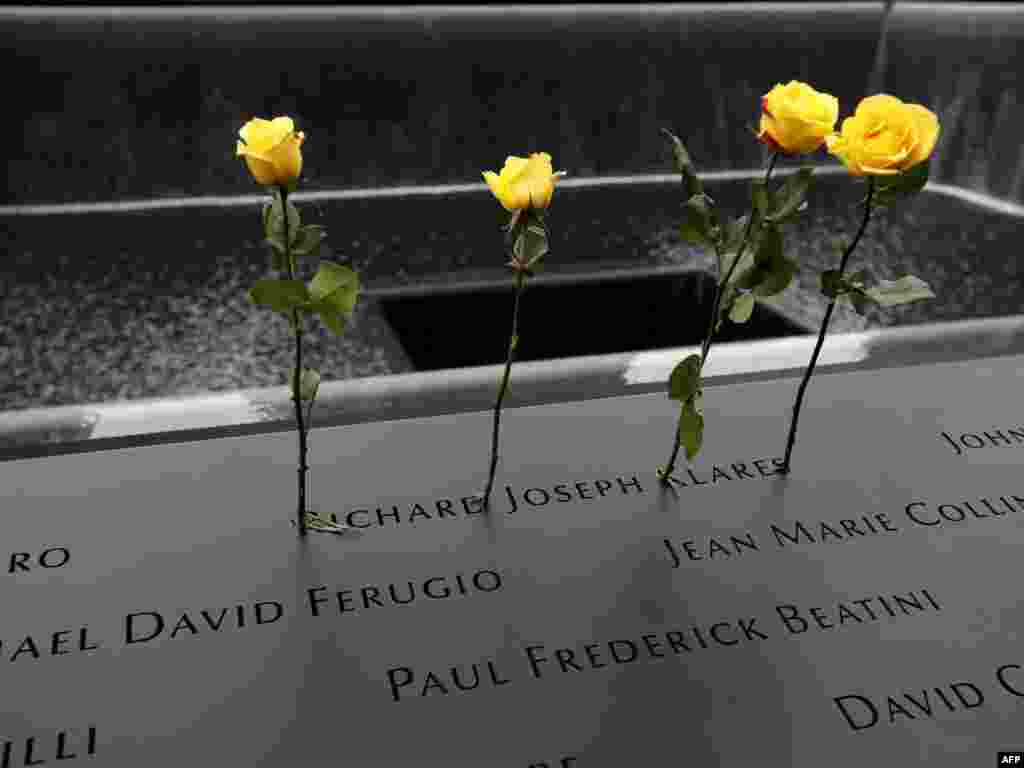 Roses are stuck in the name of Richard Joseph Klares, who was killed in the attack on the World Trade Center, at the National 9/11 Memorial site in New York.