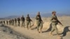 Afghan Local Police officers patrol the Afghan-Pakistan border in Nangarhar Province. Some fear the units are being used by local strongmen as independent militias.