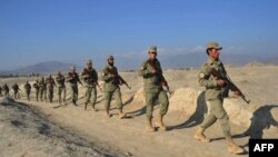 Afghan Local Police officers patrol the Afghan-Pakistan border in Nangarhar Province. Some fear the units are being used by local strongmen as independent militias.