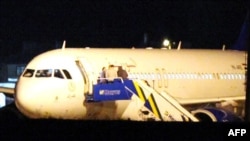 The Syrian passenger plane is seen after it was forced to land at Ankara airport on October 10.