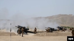 -- Pakistani soldiers use weaponry during a military operation against Taliban militants in the town of Miranshah in North Waziristan, June 25, 2014