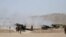 FILE: Pakistani soldiers use artillery guns during a military operation against the Taliban militants in the town in North Waziristan in June 2014.