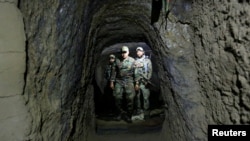On April 24, Afghan Special Forces inspect inside a cave, which was used by suspected Islamic State militants at the site where a MOAB, or ''mother of all bombs'', struck the a cave complex in Achin district of the eastern province of Nangarhar.