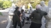 Момент задержания протестовавших женщин. Нур-Султан, 10 июня 2020 года.