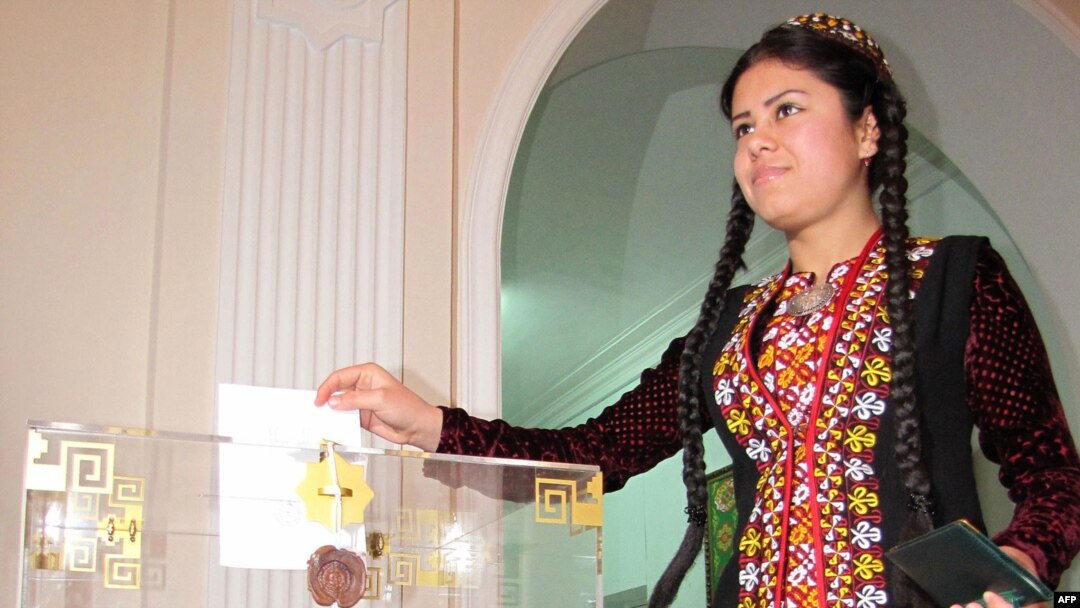 A woman casts her ballot at a polling station in Ashgabat.