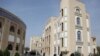 Students walk on the campus of Khatam-al Nabyeen Islamic University 