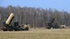 US troops from the 5th Battalion of the 7th Air Defense Regiment emplace a launch station of the Patriot air and missile defence system at a test range in Sochaczew, March 21, 2015
