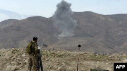 Smoke rises after an air strike by U.S. aircraft on militant positions during an ongoing an operation against Islamic State (IS) militants in Kot district of Nangarhar province on February 16.