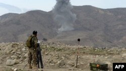 Smoke rises after an air strike by U.S. aircraft on positions during an ongoing an operation against Islamic State militants in Kot district of Nangarhar Province in February.