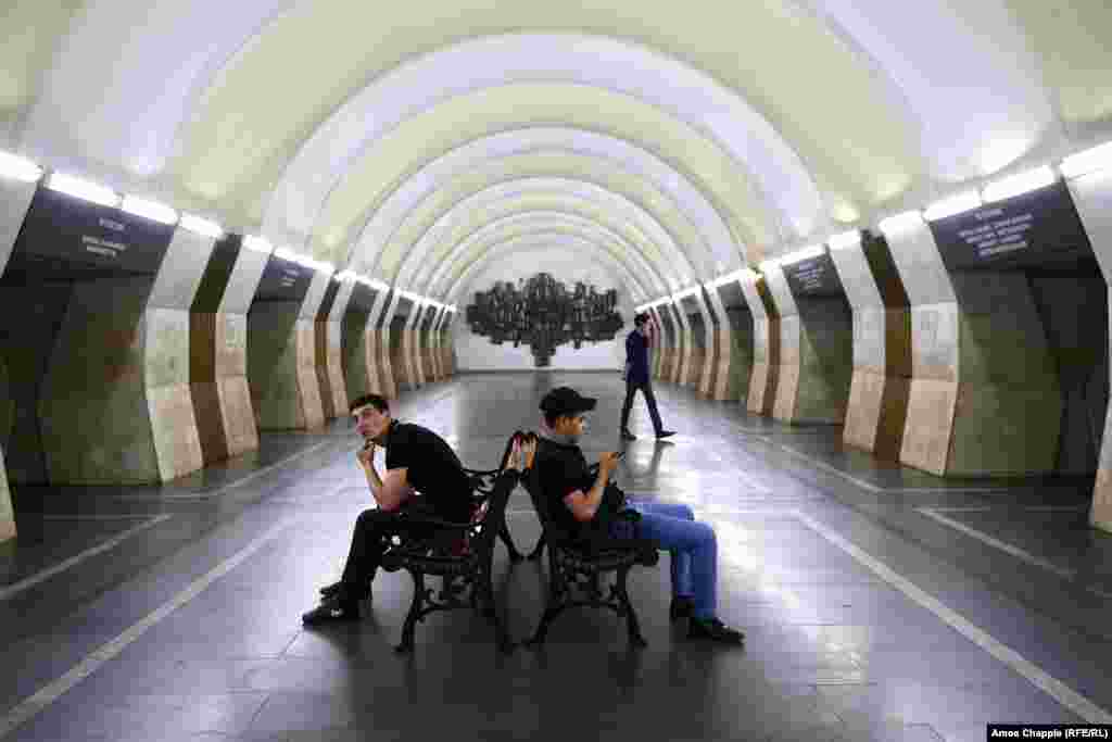 Men waiting in the subway. On May 2, Pashinian called off protests that had blocked roads across the country and some subway stations in Yerevan. On May 3, there were no closures reported. 
