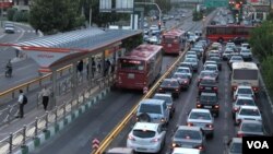 Cars in a traffic jam in Tehran as buses move faster in their separate lane. File photo