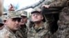 Armenia - Defense Minister Seyran Ohanian (R) inspects Armenian army positions on the border with Azerbaijan, 9Aug2013.