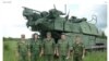 Російські солдати на тлі установки «Бук» – ілюстрація із розслідування Bellingcat