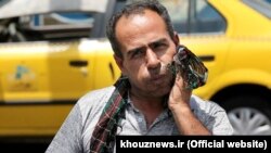 An Iranian man dealing with the heat