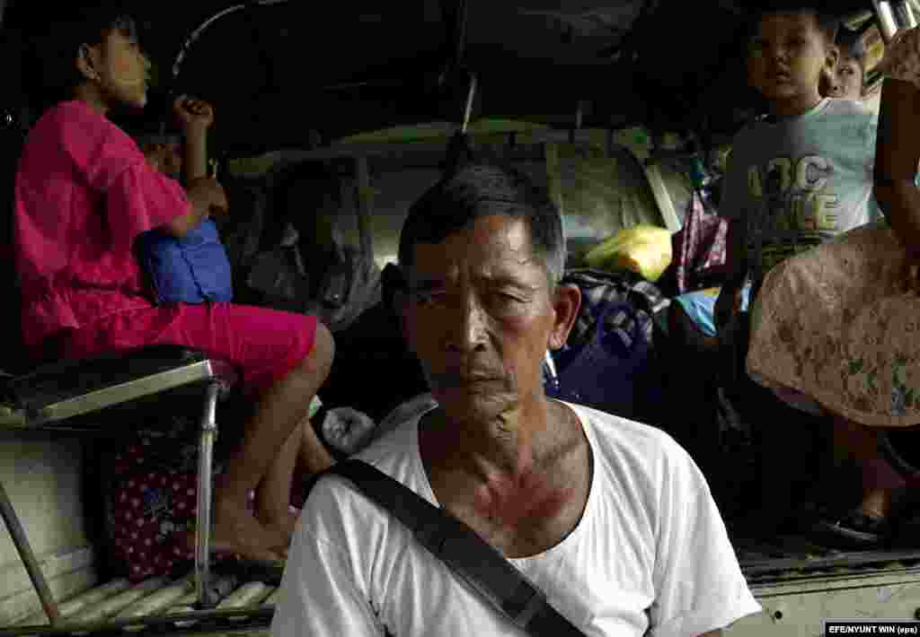 A displaced man of the Rakhine ethnic group arrives at a temporary shelter in Sittwe, Rakhine State.