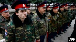 Russian Cossacks prepare to patrol the border with Ukraine.